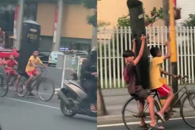 Viral! Bocah di Surabaya Gowes Sambil Bawa Tameng Polisi, Netizen: Jangan-jangan Bocah Ini Intel