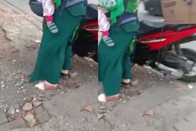 Ibu Driver Ojol Gendong Anaknya Sambil Bekerja dengan Kaki Sebelah Diperban, Netizen Sedih
