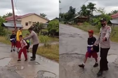 Viral Oknum Polisi yang Bantu Anak SD Nyeberang Jalan, Netizen: Seperti Diajarin Bernafas